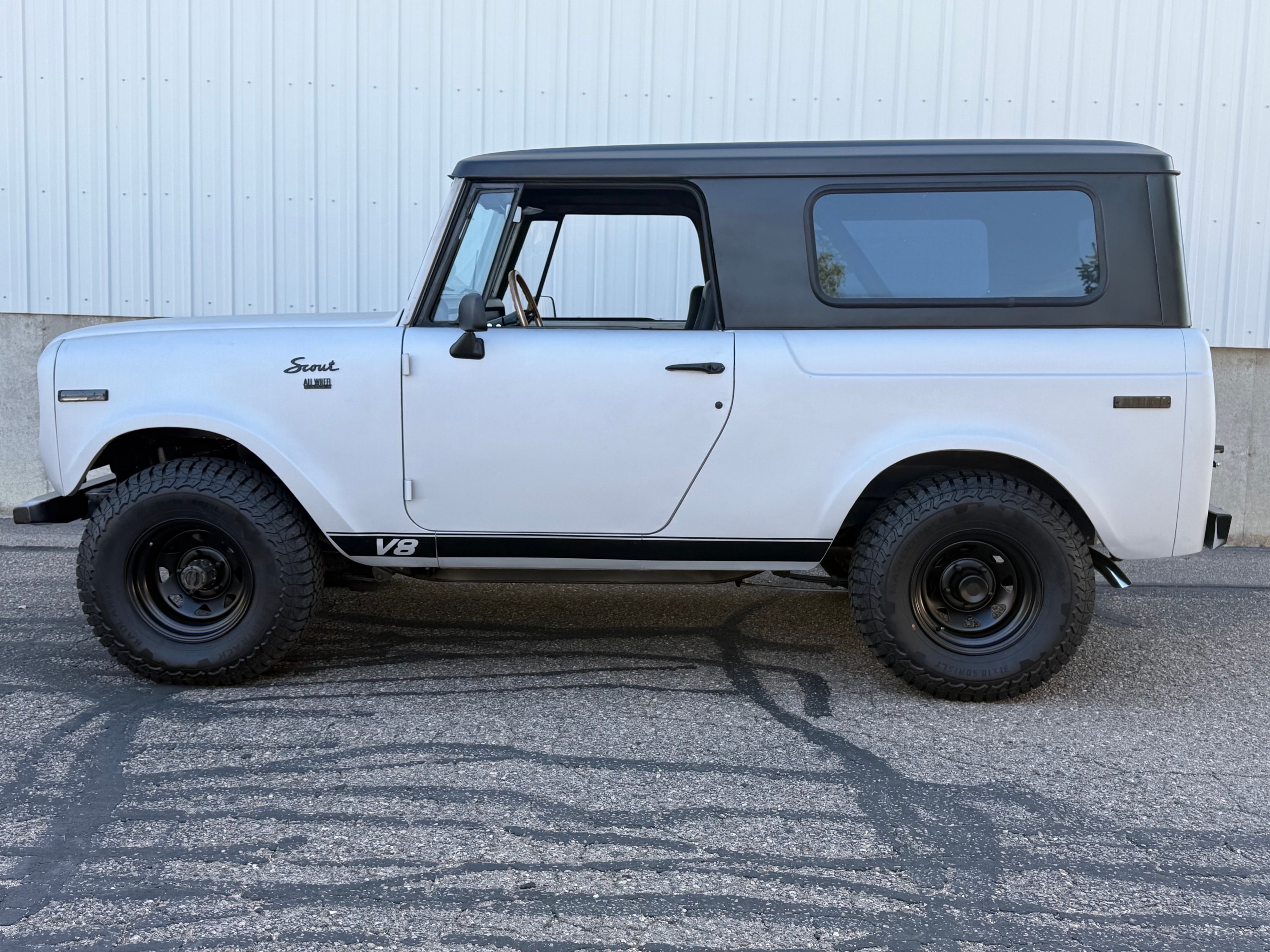 1969 Scout 800 V8 white hardtop side profile parking lot